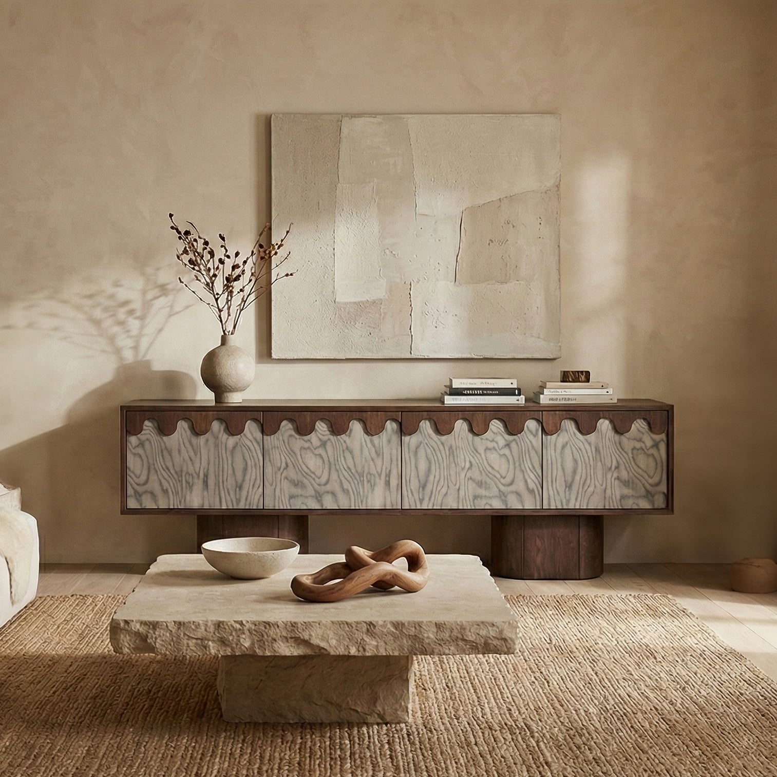Modern living room with a wooden console table, abstract painting, and decorative items.